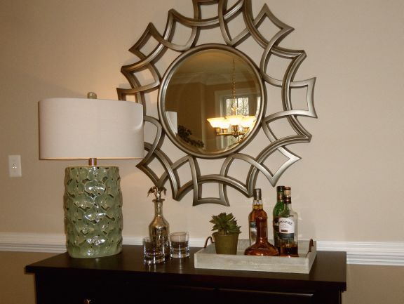 Living room bar detail; mirror, lamp, table